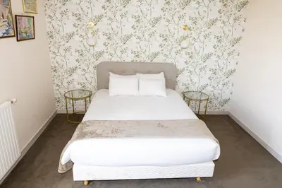 Un ou plusieurs lits dans un hébergement de l'établissement Auberge le Prieuré des Gourmands