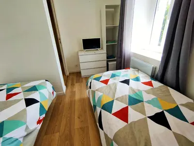 Un ou plusieurs lits dans un hébergement de l'établissement 2 chambres Centre Chateaubriant Sauna