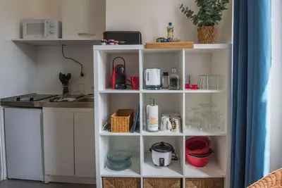 Cuisine ou kitchenette dans l'établissement Le petit cosy
