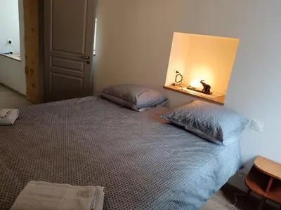 Un ou plusieurs lits dans un hébergement de l'établissement Gîte Coté Ruelle