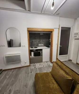 Cuisine ou kitchenette dans l'établissement La petite loge de l'ile