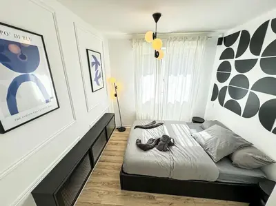 Un ou plusieurs lits dans un hébergement de l'établissement Charmant logement au bord de mer