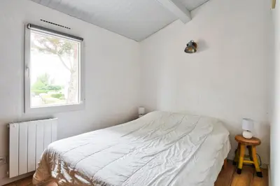Un ou plusieurs lits dans un hébergement de l'établissement Jolie maison pour 7 - 300 m de la plage - Dunes