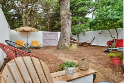 Jardin de l'établissement Jolie maison pour 7 - 300 m de la plage - Dunes