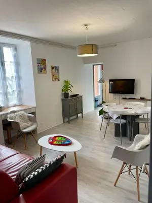 Télévision ou salle de divertissement dans l'établissement Gîte en bord de lac