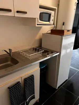 Cuisine ou kitchenette dans l'établissement Studio proche du front de mer en plein centre-ville