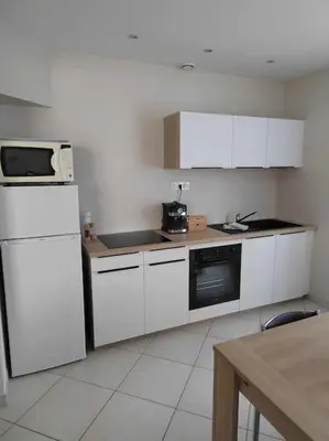 Cuisine ou kitchenette dans l'établissement La Casa Bidule