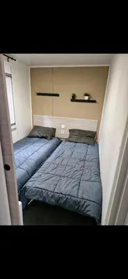 Un ou plusieurs lits dans un hébergement de l'établissement Superbe Mobil home proche de l'Océan