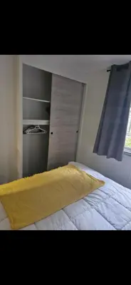 Un ou plusieurs lits dans un hébergement de l'établissement Superbe Mobil home proche de l'Océan