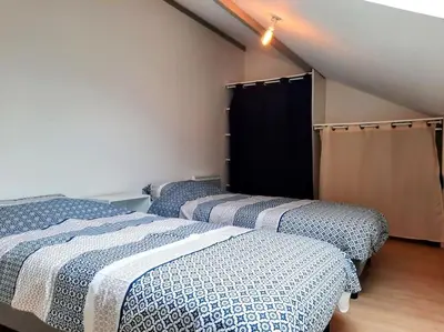 Un ou plusieurs lits dans un hébergement de l'établissement Élégante Maison de ville
