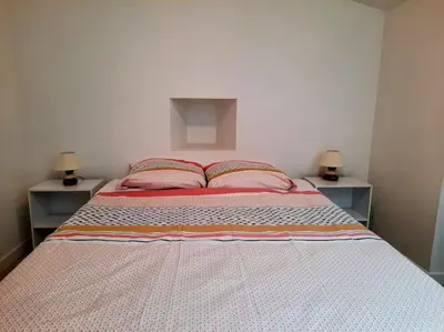 Un ou plusieurs lits dans un hébergement de l'établissement Élégante Maison de ville