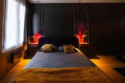 Un ou plusieurs lits dans un hébergement de l'établissement Dreamy Room - Evasion, balnéo & cinéma privé