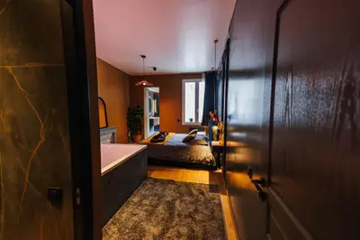 Un ou plusieurs lits dans un hébergement de l'établissement Dreamy Room - Evasion, balnéo & cinéma privé