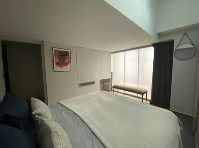 Un ou plusieurs lits dans un hébergement de l'établissement Loft Bellamy