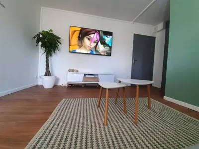 Télévision ou salle de divertissement dans l'établissement Le studio 40