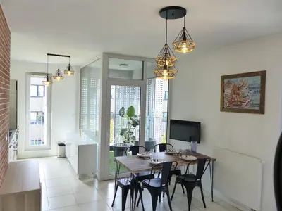 Télévision ou salle de divertissement dans l'établissement Le patio'nnément-T3-Parking