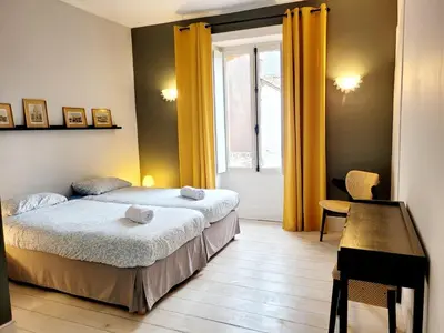 Un ou plusieurs lits dans un hébergement de l'établissement La maison de Jade