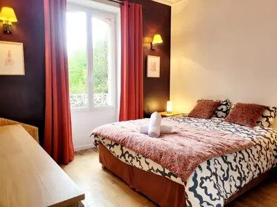 Un ou plusieurs lits dans un hébergement de l'établissement La maison de Jade