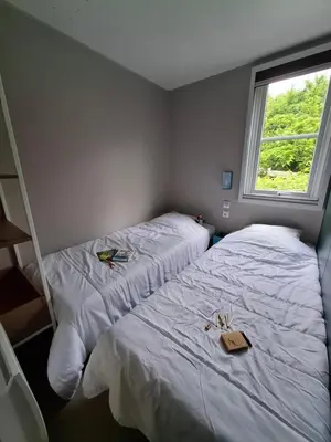 Un ou plusieurs lits dans un hébergement de l'établissement Camping L'AMBOIS