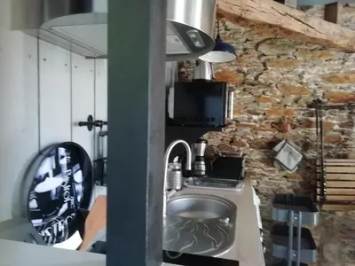 Cuisine ou kitchenette dans l'établissement Le Cottage
