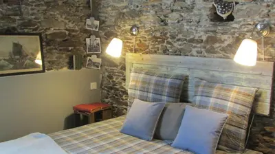 Un ou plusieurs lits dans un hébergement de l'établissement Le Cottage