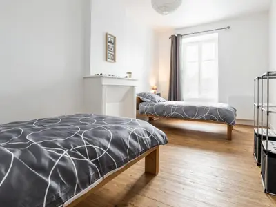 Un ou plusieurs lits dans un hébergement de l'établissement Maison rénovée avec wifi, centre bourg de St Mars la Jaille - FR-1-306-1289