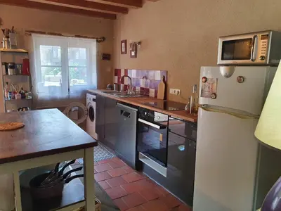Cuisine ou kitchenette dans l'établissement Maison de charme