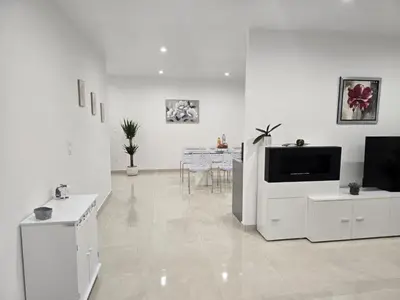 Télévision ou salle de divertissement dans l'établissement Maison Challans