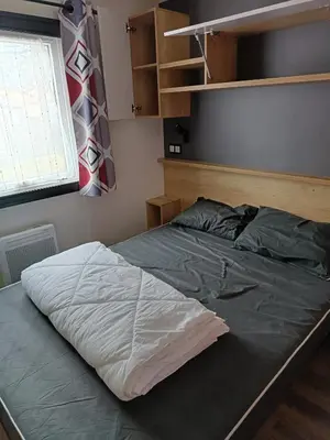 Un ou plusieurs lits dans un hébergement de l'établissement MH F101 Camping Bois Masson