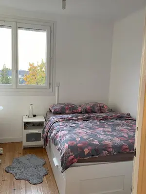 Un ou plusieurs lits dans un hébergement de l'établissement Charmant Studio