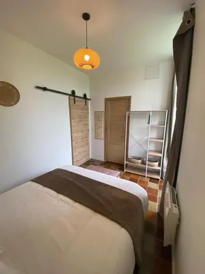 Un ou plusieurs lits dans un hébergement de l'établissement L'Origami - Domaine de la Houblette