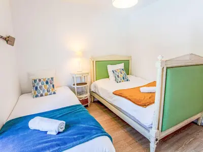 Un ou plusieurs lits dans un hébergement de l'établissement Villa Ker Rohan by Interhome