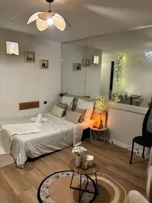 Un ou plusieurs lits dans un hébergement de l'établissement Appartement Relaxe