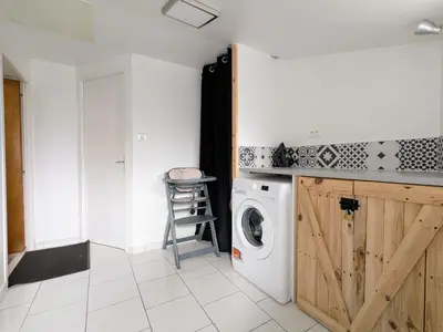 Cuisine ou kitchenette dans l'établissement Le Nid Douillet - Duplex Bois & Charme