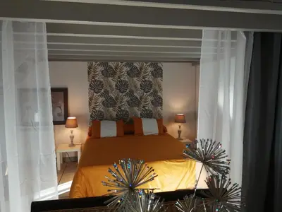 Un ou plusieurs lits dans un hébergement de l'établissement Loft la Forge