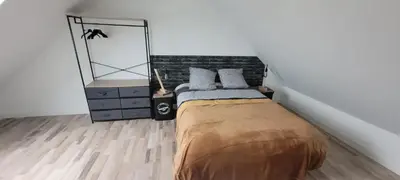 Un ou plusieurs lits dans un hébergement de l'établissement Maison confortable à Casson, 60 m², bien équipée