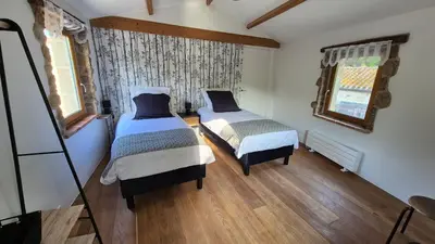 Un ou plusieurs lits dans un hébergement de l'établissement Le Cottage de Jousseaume