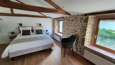 Un ou plusieurs lits dans un hébergement de l'établissement Le Cottage de Jousseaume