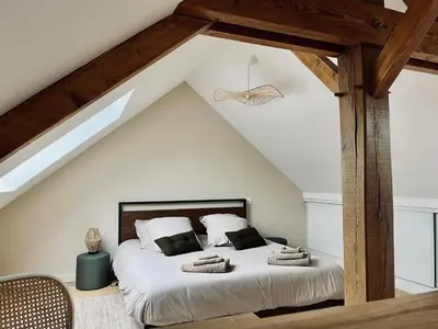 Un ou plusieurs lits dans un hébergement de l'établissement Jolie maison et terrasse Ancenis