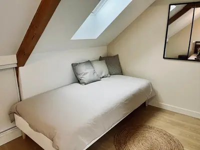 Un ou plusieurs lits dans un hébergement de l'établissement Jolie maison et terrasse Ancenis