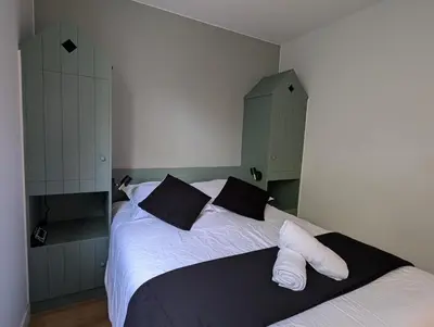 Un ou plusieurs lits dans un hébergement de l'établissement Ker Maretz Appartement lumineux entre côte et parc