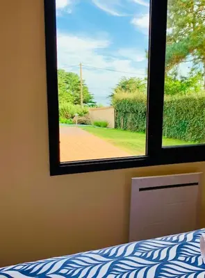 Un ou plusieurs lits dans un hébergement de l'établissement Maison familiale vue mer au calme 3 etoiles Villa Rose