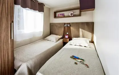 Un ou plusieurs lits dans un hébergement de l'établissement Beautiful Stacaravan