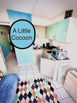 Cuisine ou kitchenette dans l'établissement Petit Cocon près de la grande plage
