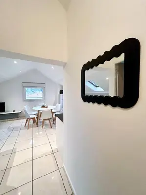 Télévision ou salle de divertissement dans l'établissement Espace cosy - Zénith & Atlantis