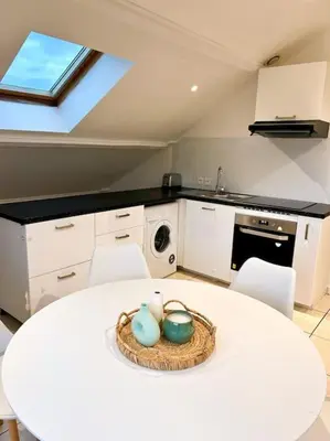 Cuisine ou kitchenette dans l'établissement Espace cosy - Zénith & Atlantis