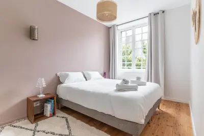 Un ou plusieurs lits dans un hébergement de l'établissement Appartement Central et Calme avec Magnifique Vue