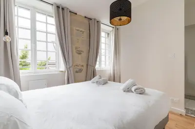 Un ou plusieurs lits dans un hébergement de l'établissement Appartement Central et Calme avec Magnifique Vue