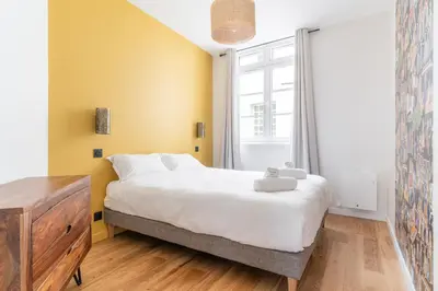 Un ou plusieurs lits dans un hébergement de l'établissement Appartement Central et Calme avec Magnifique Vue