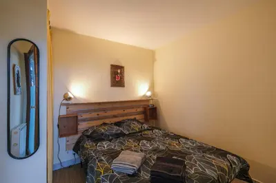 Un ou plusieurs lits dans un hébergement de l'établissement T2 cosy - vue sur le golf - proche plage